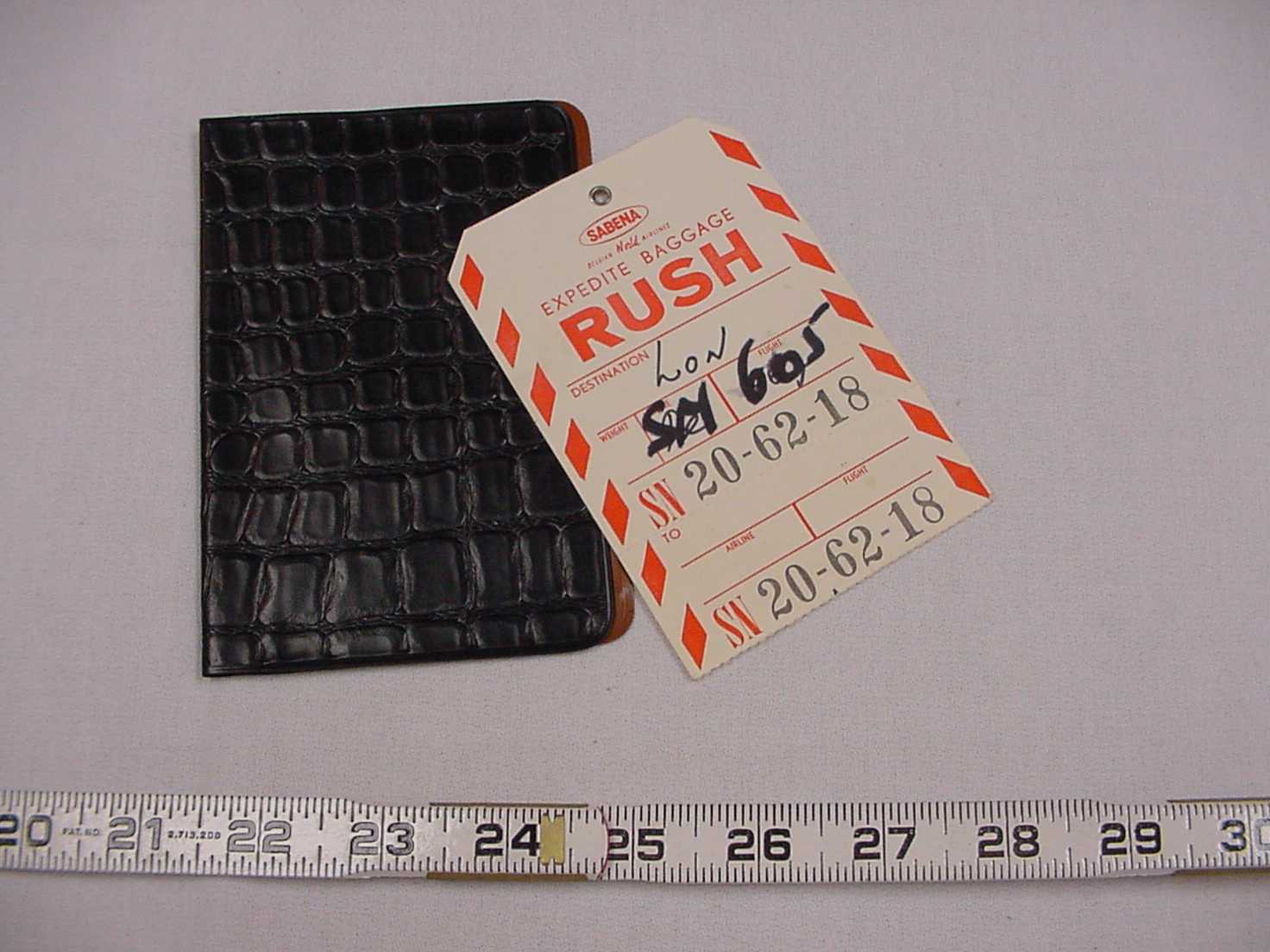 baggage claim ticket and business card case.jpg
